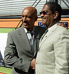 Montel Williams and Dr. Dwayne Thomas shake hands for the cameras.